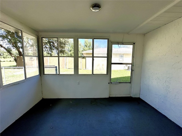 unfurnished sunroom with a wealth of natural light