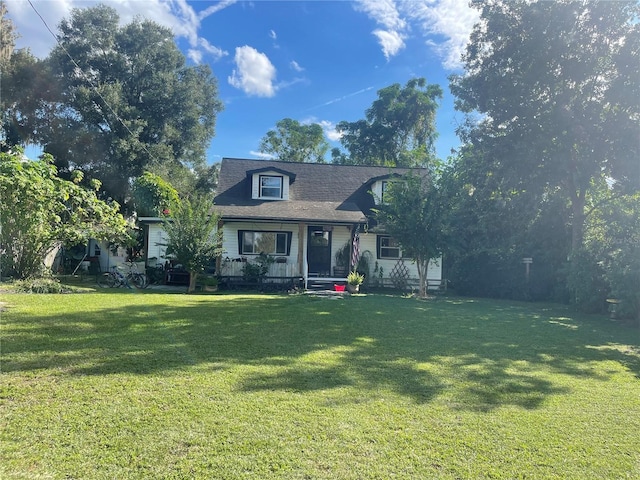 view of front of home featuring a porch and a front yard
