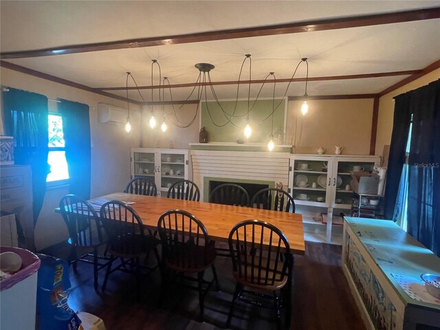 dining area featuring ornamental molding and dark wood-type flooring