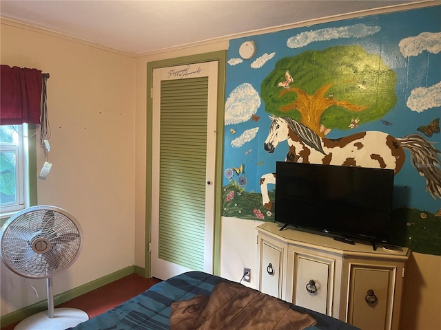 bedroom featuring crown molding