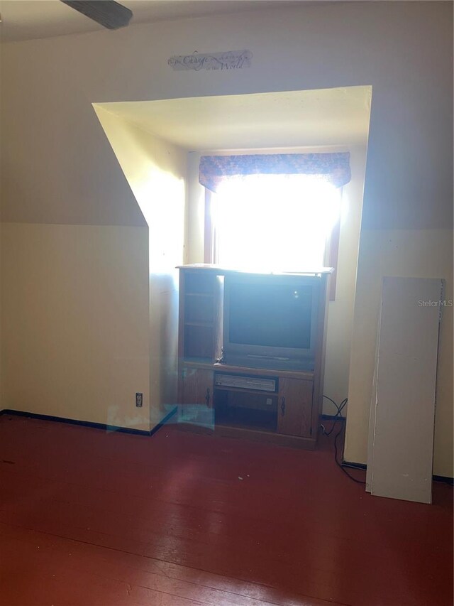 unfurnished living room with wood-type flooring