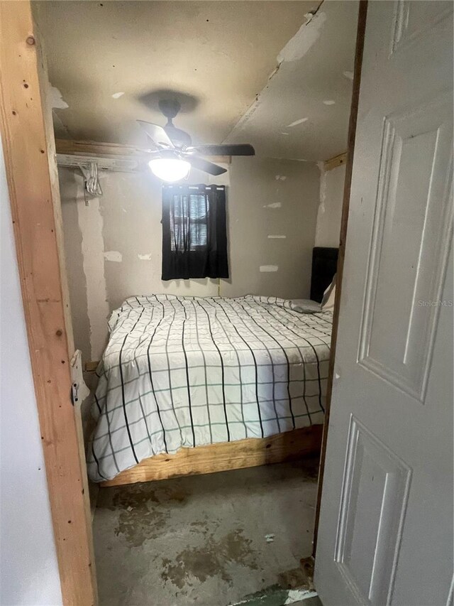 bedroom with concrete floors and ceiling fan