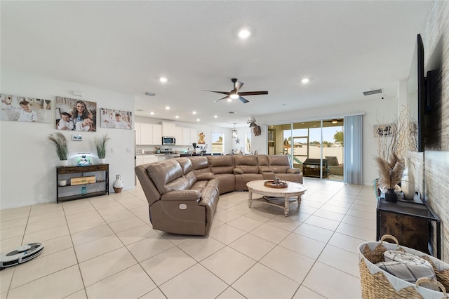 living room featuring light tile patterned flooring and ceiling fan