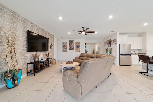 living room with ceiling fan and light tile patterned floors