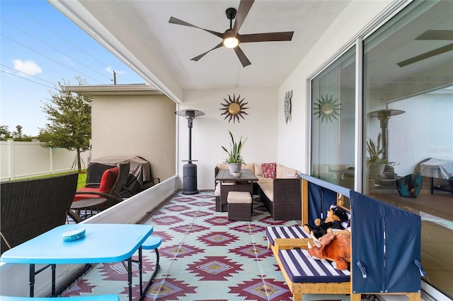 view of patio featuring an outdoor hangout area and ceiling fan