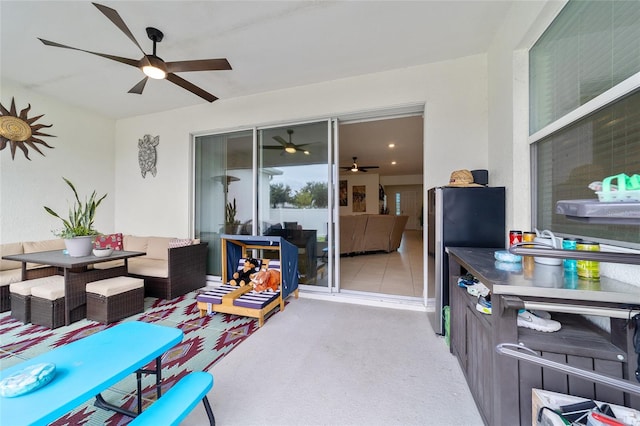 exterior space with ceiling fan and an outdoor hangout area