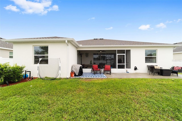 rear view of house with ceiling fan, an outdoor hangout area, a yard, and a patio