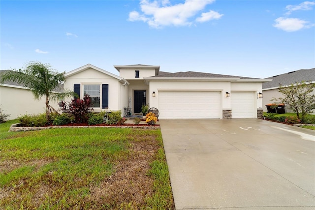 view of front of home with a front lawn and a garage