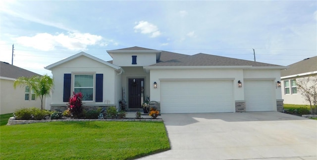 view of front of home with a front yard and a garage