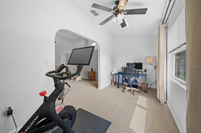 carpeted office featuring ceiling fan