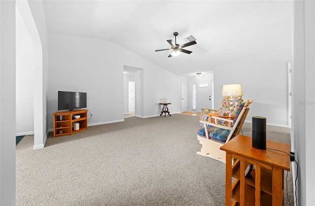 living area with carpet, vaulted ceiling, and ceiling fan