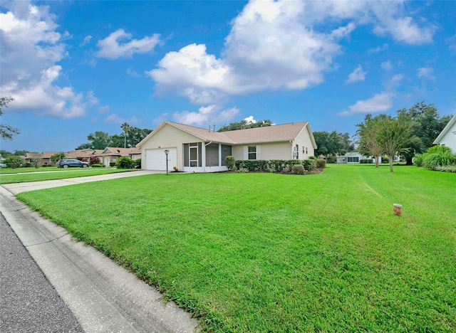 ranch-style house with a garage and a front yard