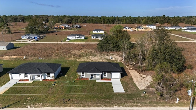 birds eye view of property with a residential view