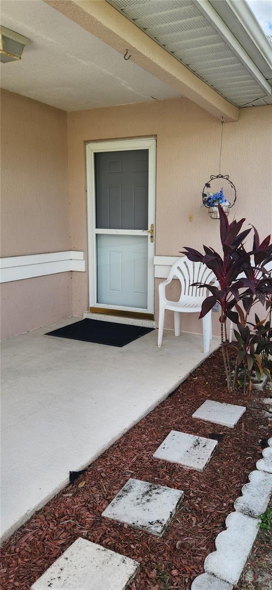 doorway to property featuring a patio