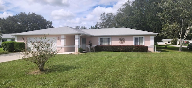 ranch-style house with a front lawn