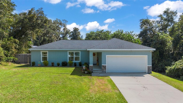 ranch-style home featuring a garage and a front yard