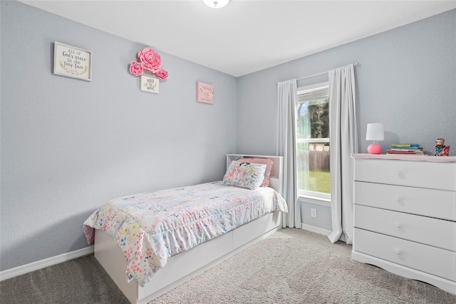 bedroom featuring light carpet