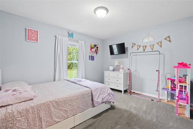 carpeted bedroom with a textured ceiling