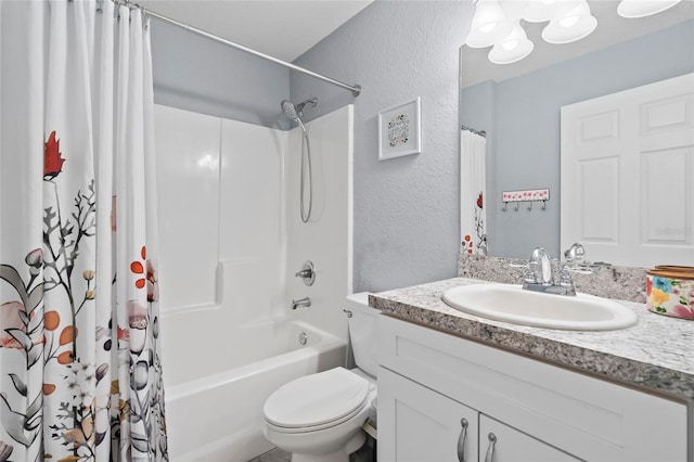 full bathroom featuring vanity, shower / tub combo, and toilet