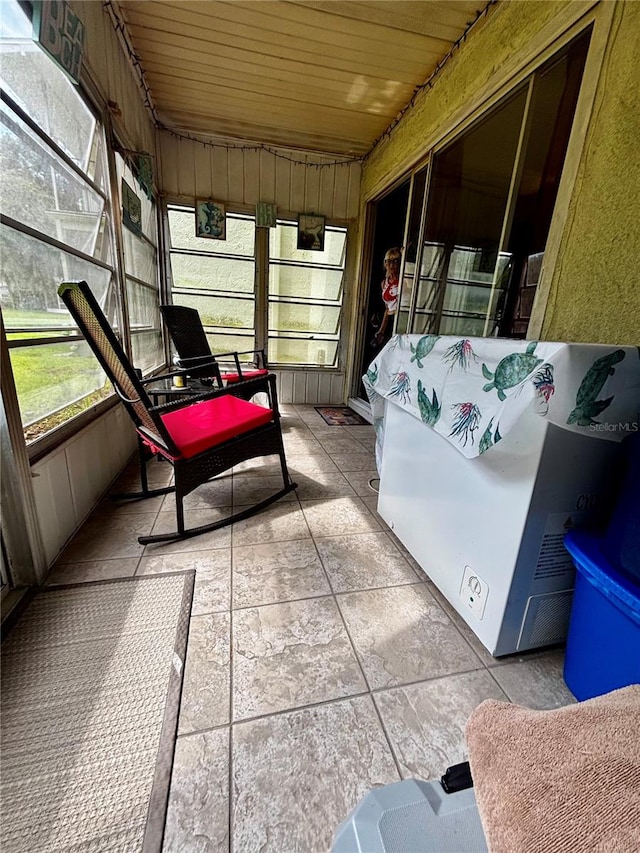 sunroom with wooden ceiling