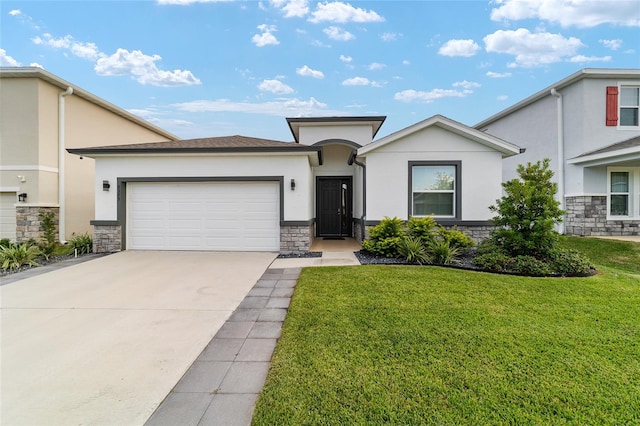 view of front of house with a garage and a front lawn