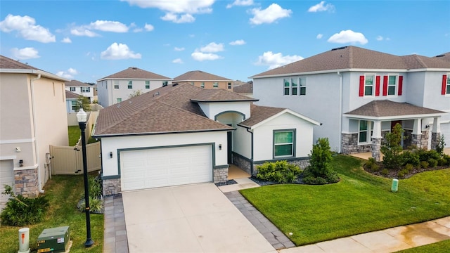 view of front facade featuring a front yard and a garage