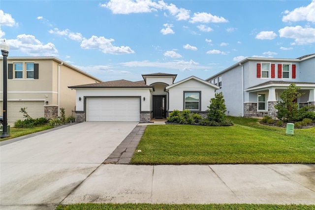 view of front of home featuring a garage and a front lawn