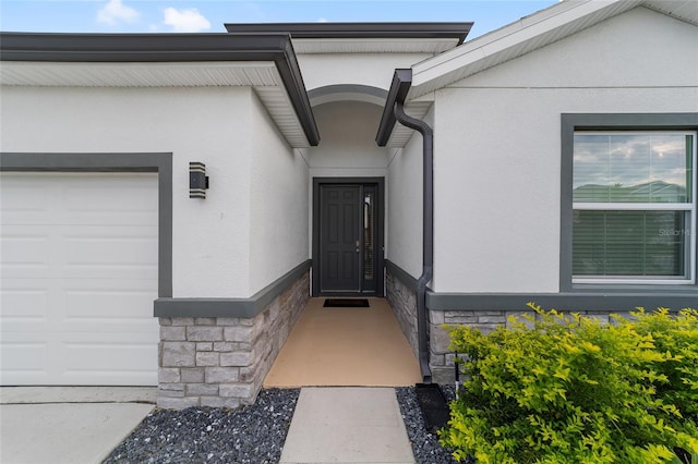 doorway to property featuring a garage