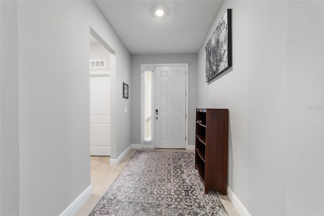 entryway featuring light tile patterned floors