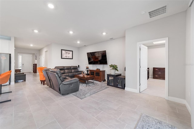 living room with light tile patterned floors