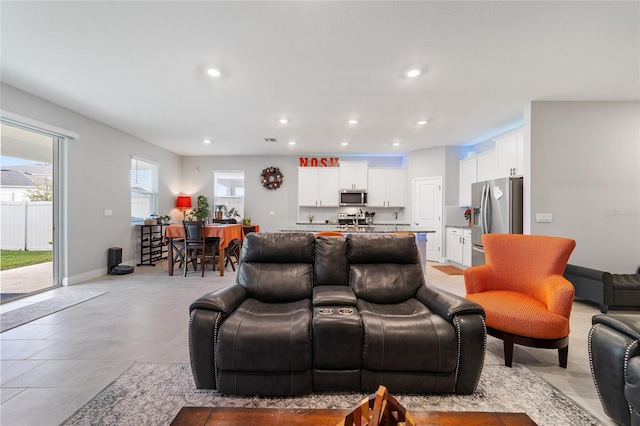 living room featuring light tile patterned flooring