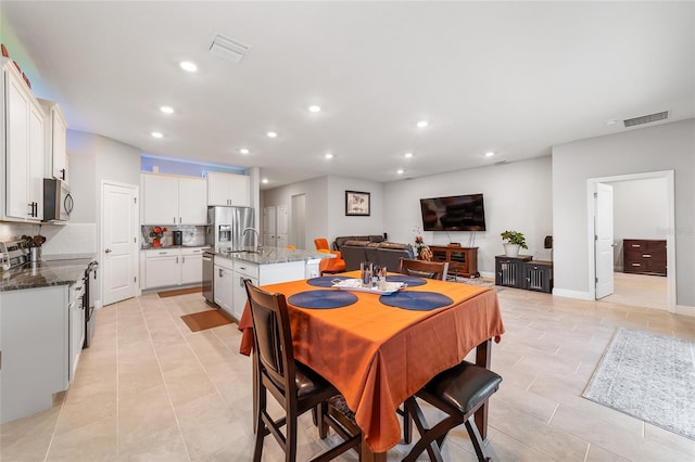 tiled dining area with sink