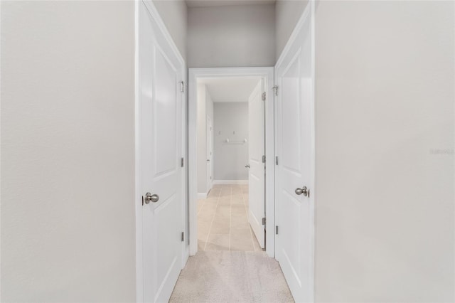 corridor featuring light tile patterned flooring