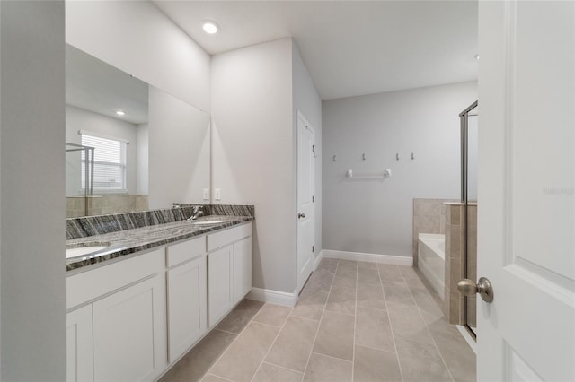 bathroom with vanity, shower with separate bathtub, and tile patterned flooring