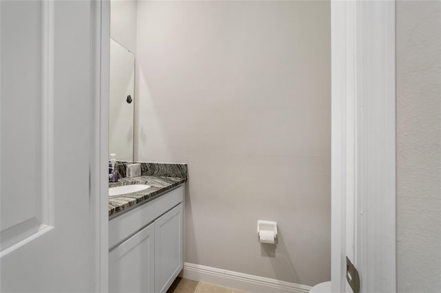 bathroom featuring vanity, toilet, and tile patterned floors