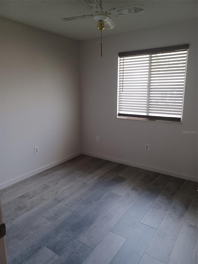 unfurnished room featuring ceiling fan and light hardwood / wood-style flooring