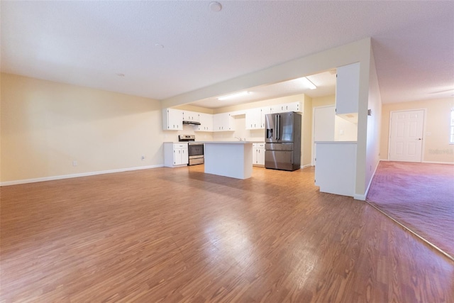 unfurnished living room with light wood-type flooring