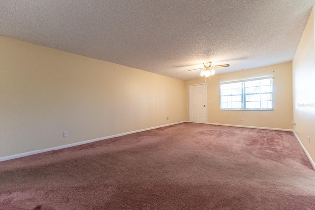 unfurnished room with ceiling fan, carpet floors, and a textured ceiling