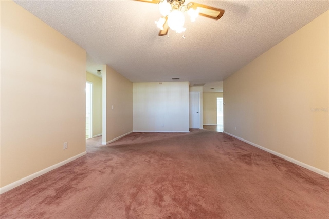 spare room featuring a textured ceiling, ceiling fan, and carpet flooring