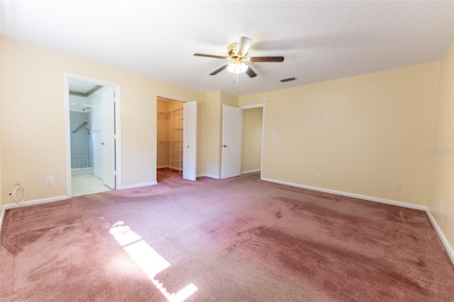 interior space featuring ceiling fan and carpet