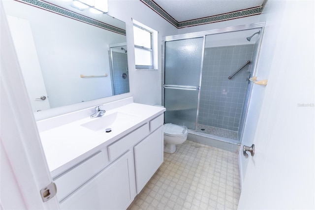 bathroom with vanity, walk in shower, and toilet