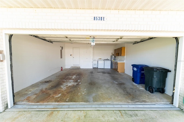 garage featuring washer and dryer