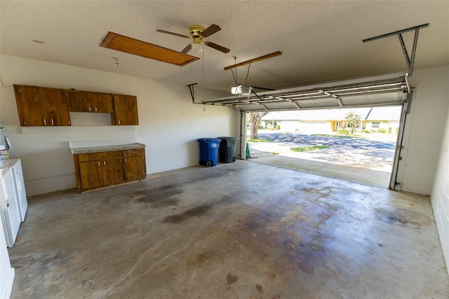 garage featuring a garage door opener and ceiling fan