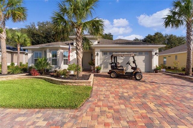 ranch-style home featuring a front yard and a garage