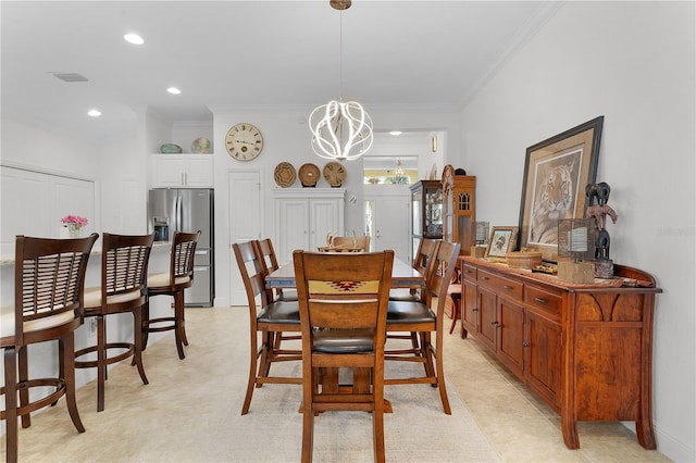 dining room featuring crown molding and a chandelier