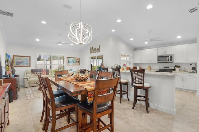 tiled dining space featuring ornamental molding, vaulted ceiling, and ceiling fan with notable chandelier