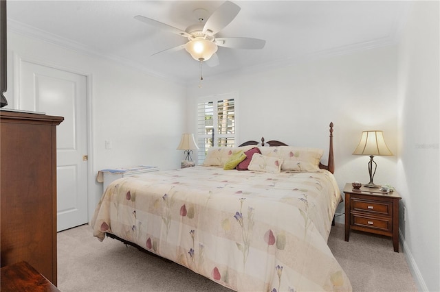 bedroom with crown molding, light colored carpet, and ceiling fan