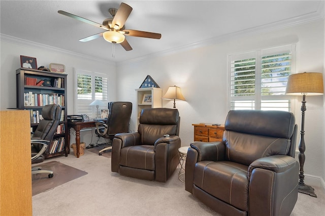 carpeted home office with ceiling fan and ornamental molding