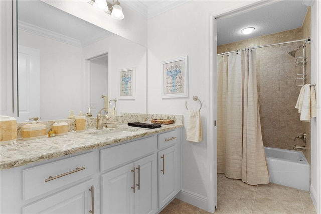 bathroom with tile patterned flooring, shower / bath combo with shower curtain, ornamental molding, vanity, and a textured ceiling