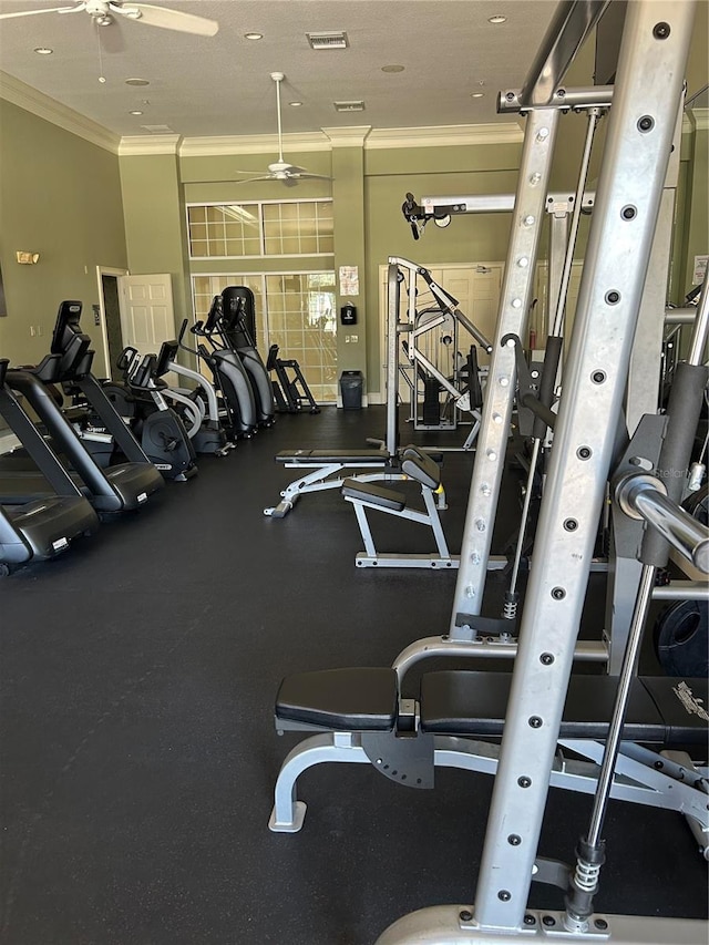 exercise room featuring crown molding and ceiling fan